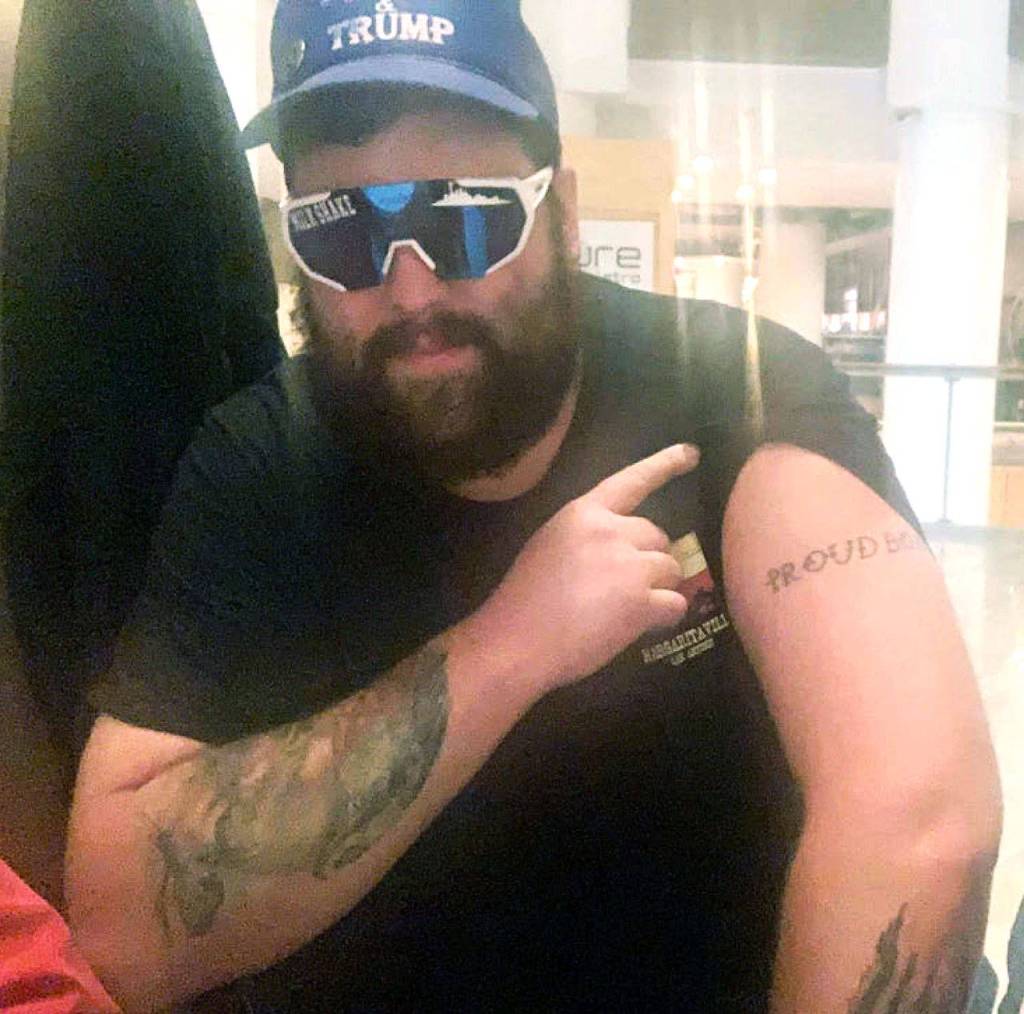 Daniel Scott, displaying a Proud Boys tattoo, in a photo from federal charging papers. (FBI)