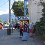 Residents wait outside the North Bend Theater on the opening night of North Bend Film Fest on Thursday, July 15. Photo by Conor Wilson/Valley Record