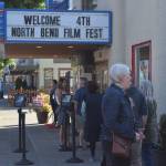 Residents wait outside the North Bend Theater on the opening night of North Bend Film Fest on Thursday, July 15. Photo by Conor Wilson/Valley Record