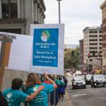 County employees and supporters walk around the block during a march for womens safety at work in Seattle on Friday, Aug. 6, 2021. The march was scheduled after a woman was attacked in a bathroom at the King County Courthouse. Photo by Henry Stewart-Wood/Sound Publishing