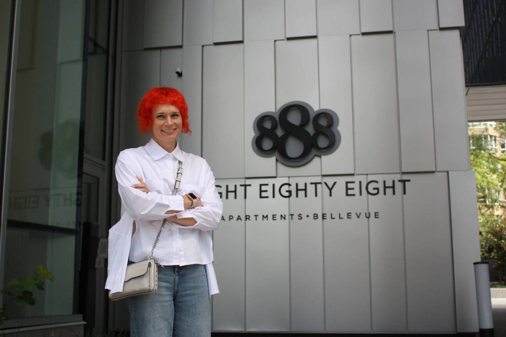 HEWITT architectural Director of Design, Julia Nagele stands in front of Bellevues 888 building (photo credit: Cameron Sheppard)