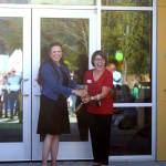 Rebekah McHugh and Encompass Executive Director Nela Cumming cut the ribbon at the Child Development Centers grand opening on Aug. 19. Photo by Conor Wilson/Snoqualmie Valley Record