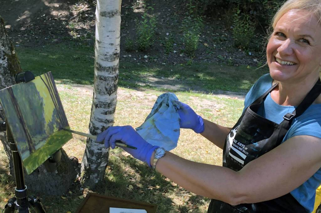 Local artist Britt Greenland paints Aug. 28 at Sandy Cove Park. Her gallery is located at 301 W. North Bend Way, Suite 107, North Bend. Visit www.BrittGreenlandArtist.com. Photo by Andy Hobbs/Valley Record