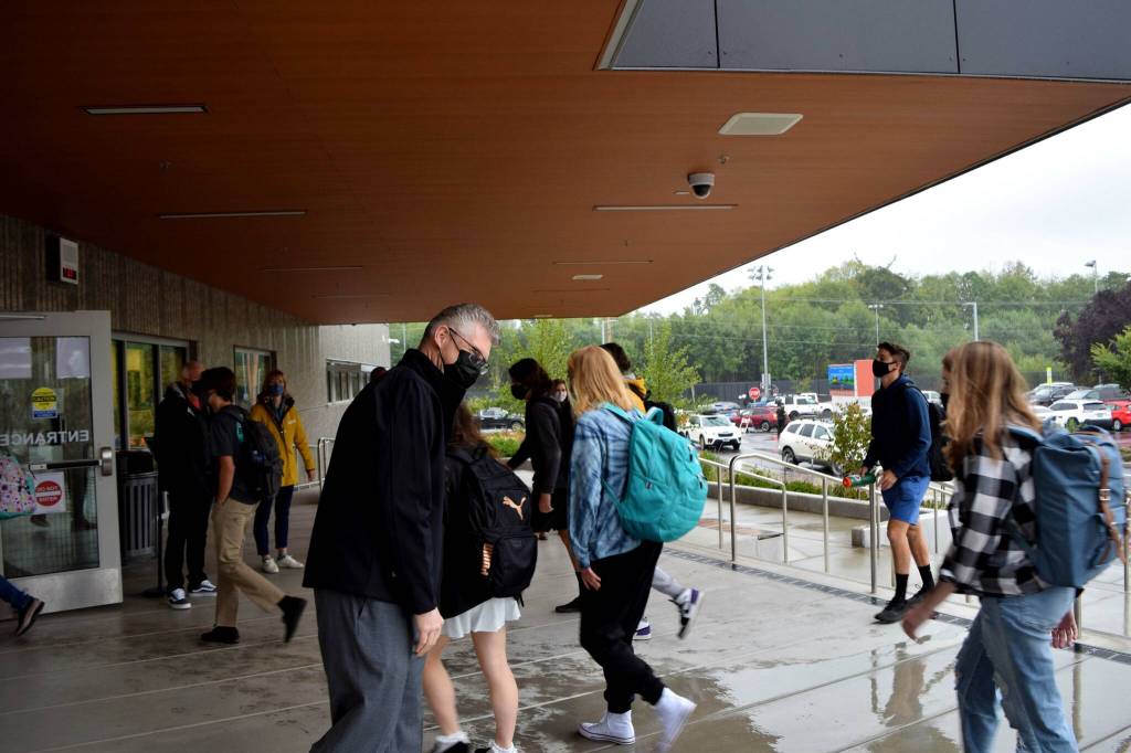 Snoqualmie Valley School District Superintendent Lance Gibbon (left) welcomes Mount Si High School students on their first day of school, Aug. 31. Photo Conor Wilson/Valley Record.
