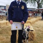 James Graham, a Mount Si FFA student, poses with his goat, Violet, after winning Royal Critter Award at King County Fair in Enumclaw. Photo Courtesy of Amy Graham.