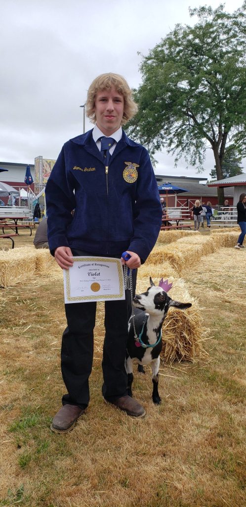 James Graham, a Mount Si FFA student, poses with his goat, Violet, after winning Royal Critter Award at King County Fair in Enumclaw. Photo Courtesy of Amy Graham.