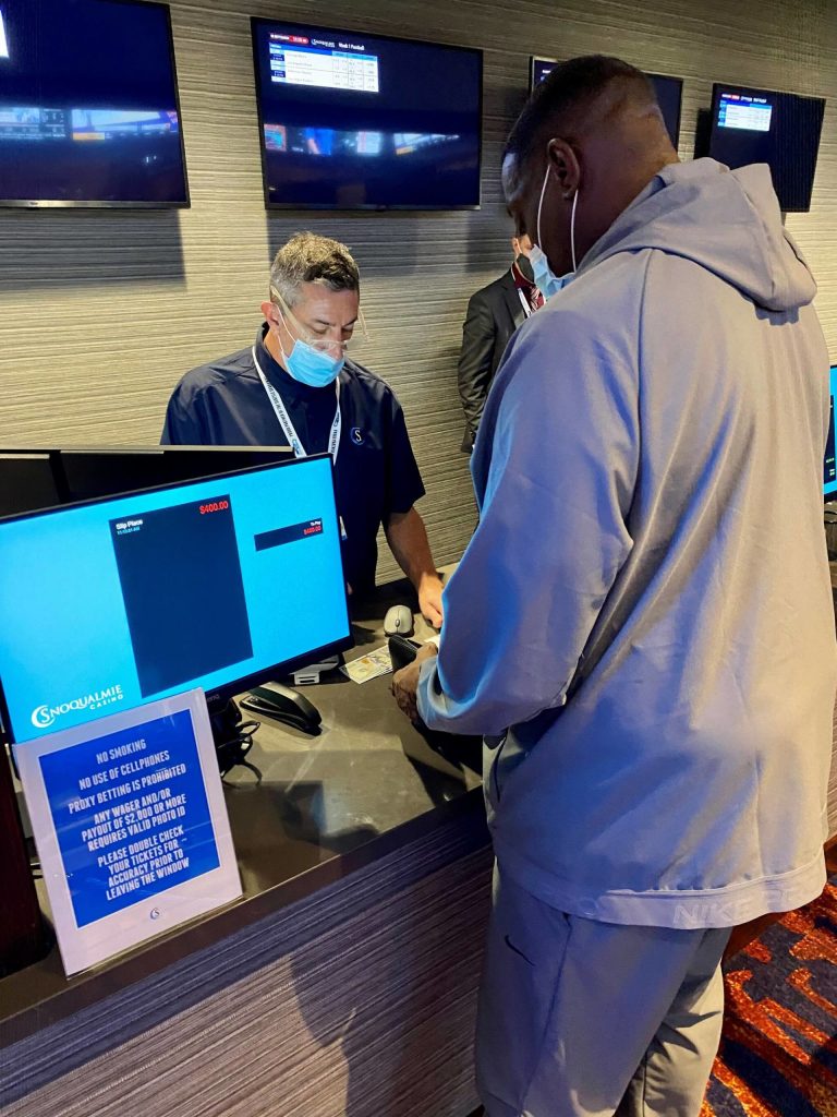 Former Seattle Sonic Shawn Kemp places the first legal sports bet in state history Sept. 9 at the Snoqualmie Casino. Photo Courtesy of the Snoqualmie Casino