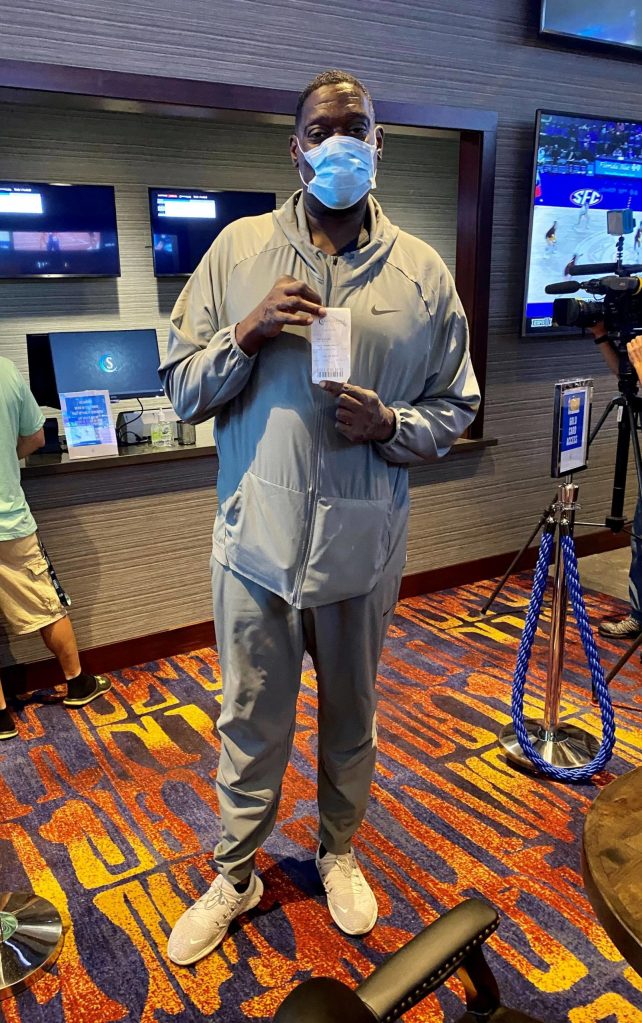 Former Seattle Sonic Shawn Kemp presents his ticket from from the first legal sports bet in state history at the Snoqualmie Casino on Sept. 9. Photo courtesy of the Snoqualmie Casino