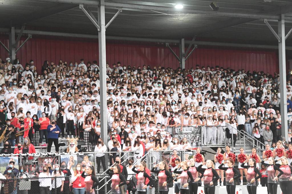 Masked spectators watch Mount Sis Sept. 10 football game against Yelm High School. Photo Courtesy of Calder Productions.