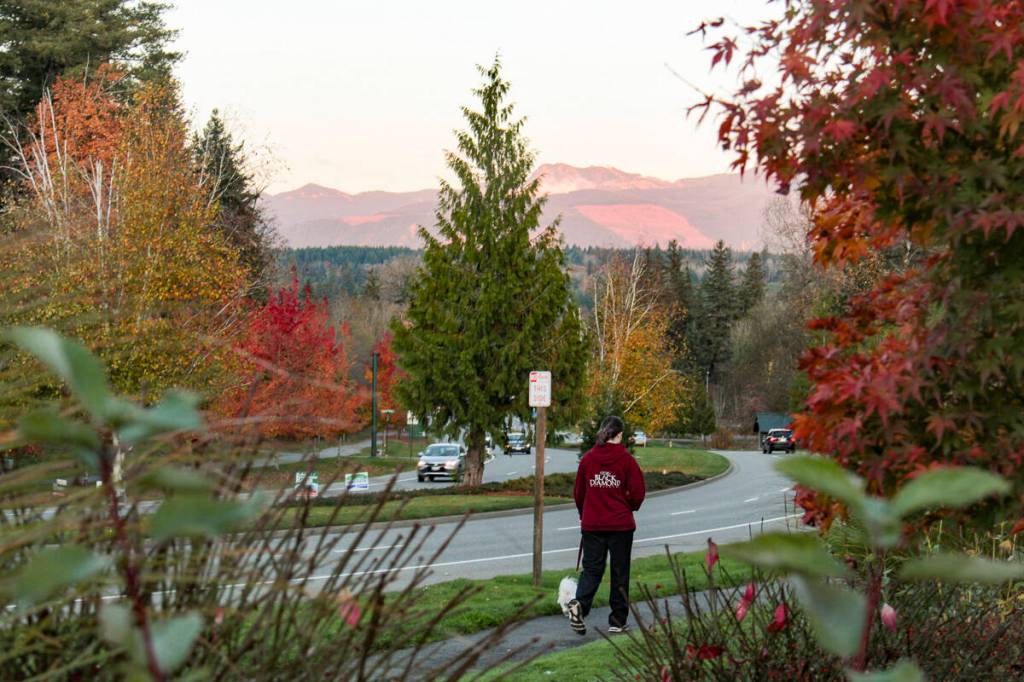 File photo
A pedestrian walks along Snoqualmie Parkway in October 2019. Improvements are coming to the roadway soon, according to the citys new transportation plan.