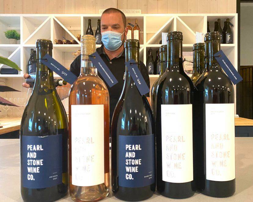 Chris Stone and the Pearl and Stone wine selection. Photo by William Shaw/Valley Record