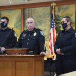 James Aquirre (middle left) being sworn in by Police Chief Perry Phipps (middle right) at a city council meeting on Aug. 9, 2021. File photo by Conor Wilson/Valley Record.