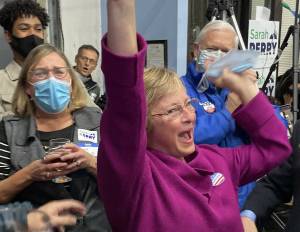 King County Councilmember-elect Sarah Perry and a celebration photo, courtesy of her campaign manager Robby Paige.