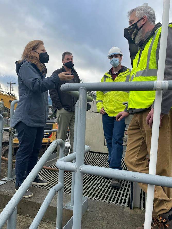 U.S. Rep. Kim Schrier (D-08) (left) speaks with North Bend Waste Water Treatment Plant Manager Jeff Leamon (right-front), alongside Public Works director, Mark Rigos (left-back) and Plant Engineer Don DeBerg (right-back). Courtesy of the City of North Bend.