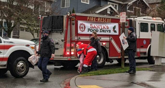 The Snoqualmie Fire and Police Department participated in the second annual Santa Parade and Food Drive on Dec. 18, to benefit the Helping Hands Ministry Backpack Program. The group provided food for over 200 kids who face food insecurity and provided gifts to 262 kids in the Valley. Courtesy photo