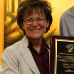 Kathy Lambert receives a key to the city from Snoqualmie Mayor Matt Larson on Dec. 13. Courtesy photo