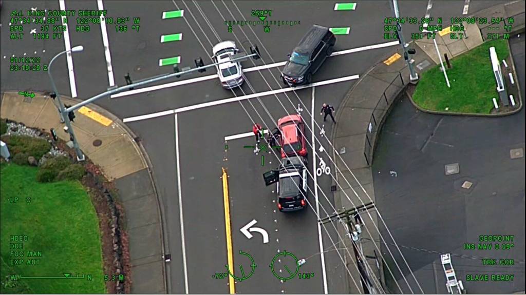 Guardian One footage shows Issaquah police officer attempting to remove suspect from stolen vehicle but gets run over in the process. Courtesy of King County Sheriffs Office Air Support Twitter.