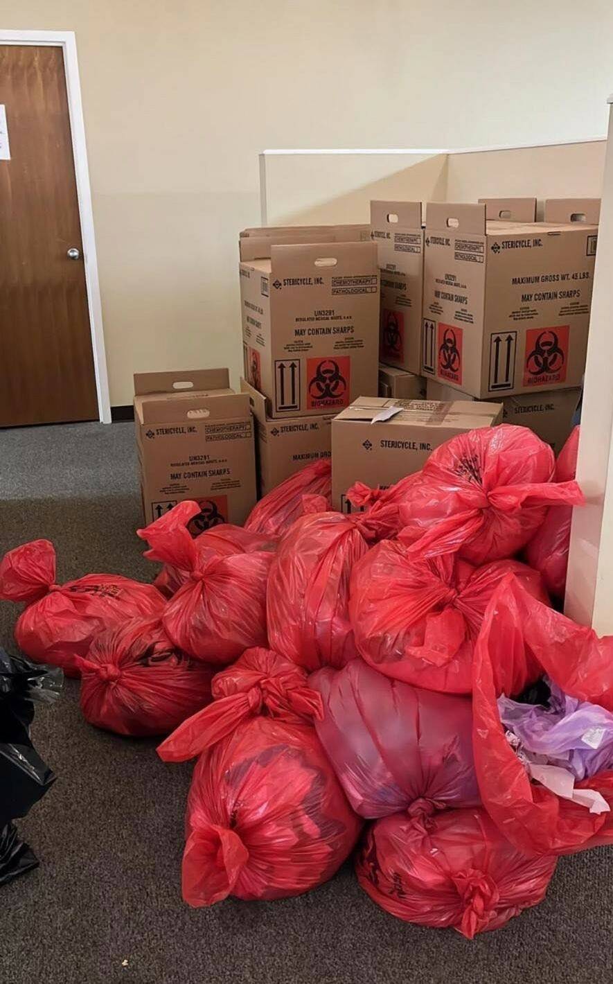 COVID-19 tests stored in trash bags. Photo from the Attorney Generals Office.