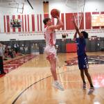 Photo courtesy of Calder Productions. MSHS Senior Quin Patterson shoots over a Bothell defender in the Wildcats 104-55 victory on Feb. 12. With the win, the top seeded Wildcats will face rival and number four ranked Skyline in the KingCo/WesCo District semi-final on Feb. 15.