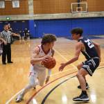 Photo Courtesy of Calder Productions. Senior Bennett OConnor dribbles past a defender in 69-58 win over Gonzaga Prep on Feb. 26.