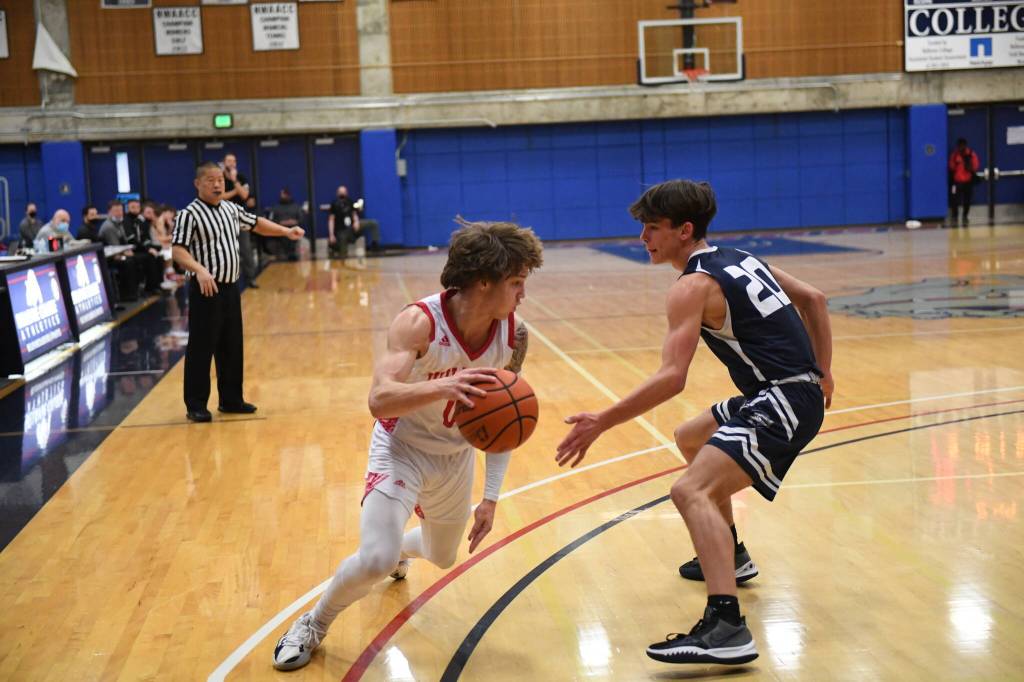 Photo Courtesy of Calder Productions
Senior Bennett OConnor dribbles past a defender in 69-58 win over Gonzaga Prep on Feb. 26.