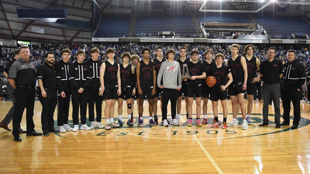 Photo Courtesy of Calder Productions. The Mount Si boys basketball team pose with the runner-up trophy at the WIAA 4A state championship game March. 5.