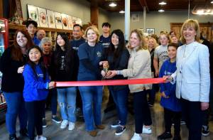 Snoqualmie Trading Co. owners, Heather Dean, Julie Chung and Cheri Buell (center), celebrate the grand opening of their new shop with SnoValley Chamber of Commerce Executive Director Kelly Coughlin (left) and Snoqualmie Mayor Katherine Ross (right) on March 18.