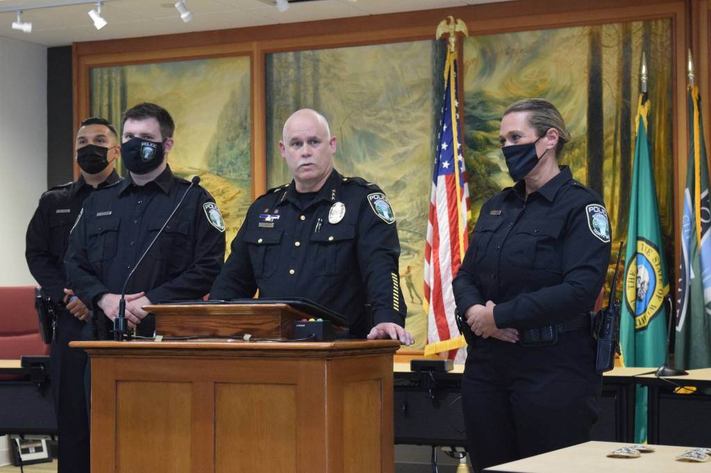 File photo
Police Chief Perry Phipps (center) speaks about new Snoqualmie police officers at oath of office ceremony in 2021. Pictured left to right: Ricard Velasquez (in back), James Aquirre and Pamela Mandery.