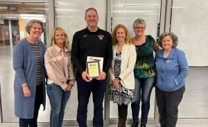 Photo courtesy of the Snoqualmie Valley School District
Outgoing Mount Si Principal John Belcher (center) stands next to members of the Mount Si PTSA Board after being named the Washington Parent-Teacher Association Outstanding Educator of the year in 2022. From left: Wendy Talens, Jennifer Fierling, Belcher, Thyra Demetrick, Kim Jones and Linda Grez.