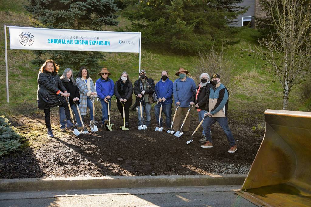 Photo courtesy of the Snoqualmie Tribe. Snoqualmie Tribal Chairman Robert de los Angeles and members of the Snoqualmie Tribal Council celebrate plans for a new 210-room hotel on their reservation.