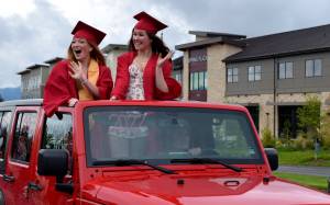 Mount Si High School seniors wave to parade watchers during during the Senior Car Parade on Saturday, June 4. The class of 2022 will hold its graduation Friday, June 10, at the ShoWare Center in Kent. Photo by Conor Wilson/Valley Record.