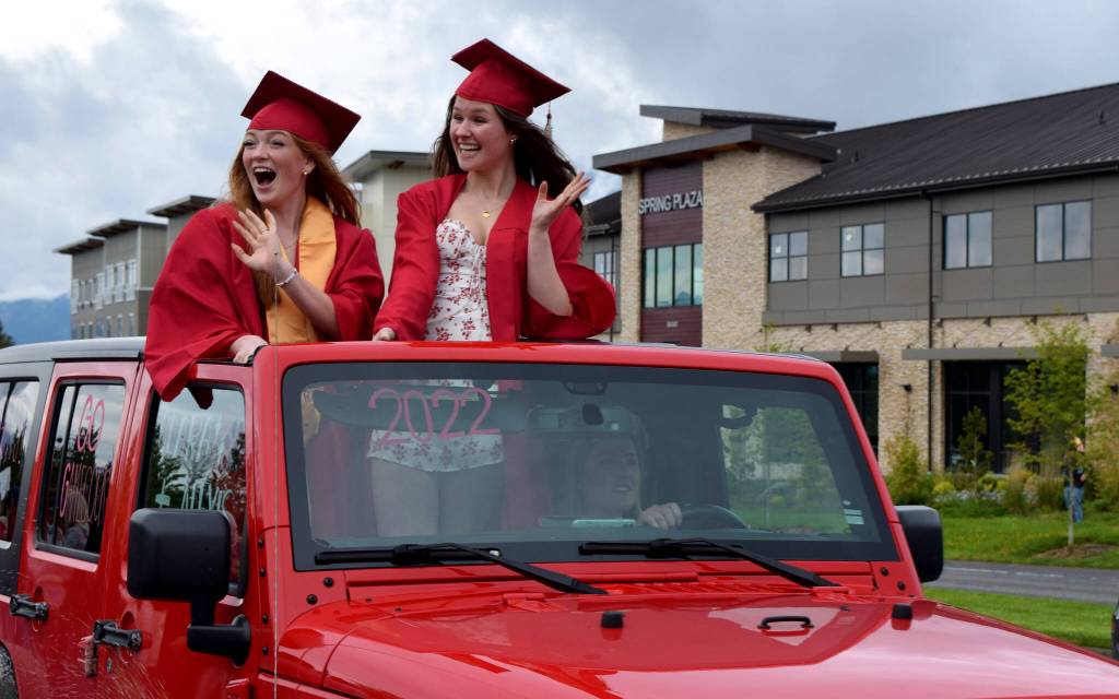 Mount Si High School seniors wave to parade watchers during during the Senior Car Parade on Saturday, June 4. The class of 2022 will hold its graduation Friday, June 10, at the ShoWare Center in Kent. Photo by Conor Wilson/Valley Record.