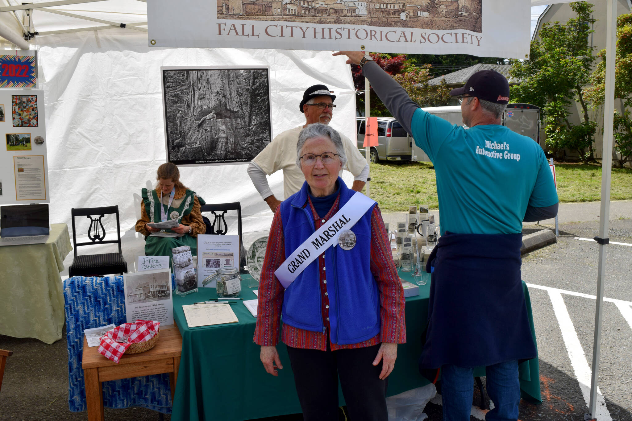 Fall City Days 2022 Grand Marshal Ruth Pickering poses in front of the Fall City Historical Society tent. Read all about Pickering and her contributions to Fall City at bit.ly/3tvSDVO.