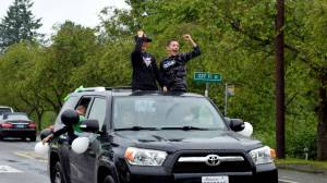 Two boys celebrate during the Fall City Graduate Parade on June 17. Photo Conor Wilson/Valley Record.
