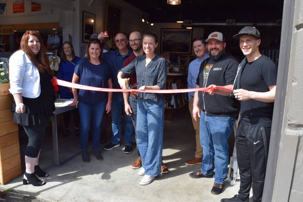 Meghan and David Schumacher (center), owners of Arete Coffee Bar in North Bend, hold a ribbon cutting to celebrate the opening of their business on June 20. Photo Conor Wilson/Valley Record.