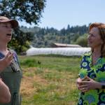 Photo courtesy of U.S. House Agriculture Committee
U.S. Rep. Kim Schrier, D-Sammamish, (right) speaks with Local Roots vegetable Farm owners Siri Erickson-Brown and her husband Jason Salvo on their property in Duvall.
