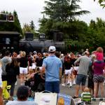 Spectators at Snoqualmie Days watch a train go by on Railroad Avenue. Photo Conor Wilson/Valley Record.