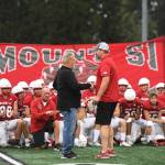 Longtime head coach Charlie Kinnune (left) shakes hands with new head coach Steve Botulinski. Kinnune retired after last season, having coached the Wildcats since 1992. Photo Courtesy of Calder Productions.