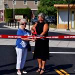 Conor Wilson / Valley Record 
Carnation Mayor Kim Lisk (center right) and Connie Carter celebrate the near end of construction along Tolt Avenue on Aug. 31.