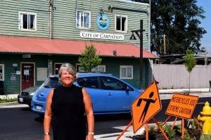 Conor Wilson / Valley Record 
Kim Lisk poses in front of City Hall on her last official day as Mayor of Carnation.