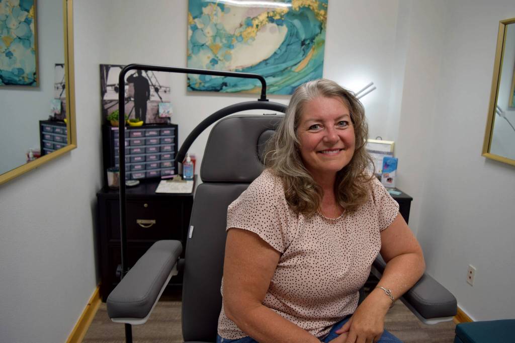 Beverly Davidson, owner of Quill and Ink Tattoo, sits inside her studio located at 111 W. North Bend Way. Photo by Conor Wilson/Valley Record