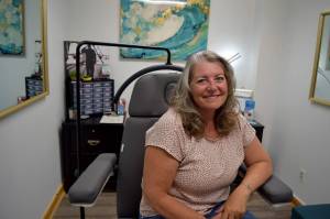 Beverly Davidson, owner of Quill and Ink Tattoo, sits inside her studio located at 111 W. North Bend Way. Photo by Conor Wilson/Valley Record