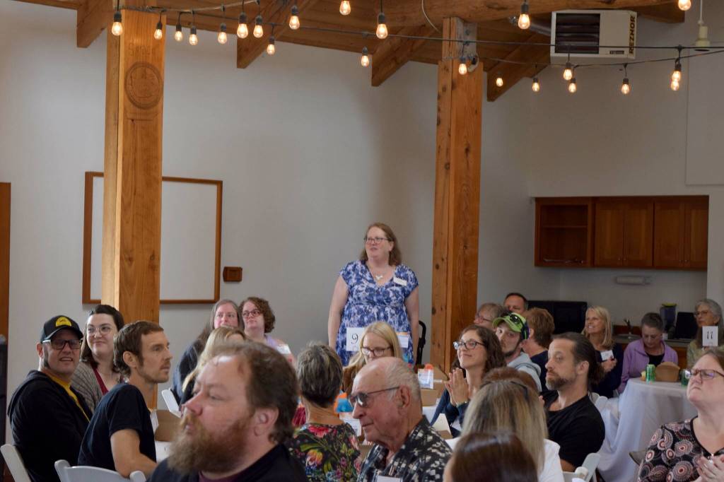 Snoqualmie Valley Shelter Services Program Coordinator and founding member Trissa Dexheimer stands for recognition at the Reclaiming Stability Benefit Luncheon on Sept. 15. Photo Conor Wilson/Valley Record.