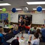 Carla Netus second grade class at North Bend Elementary listen to a presentation by Clark and Karrie Roberts. Photo by Conor Wilson/Valley Record