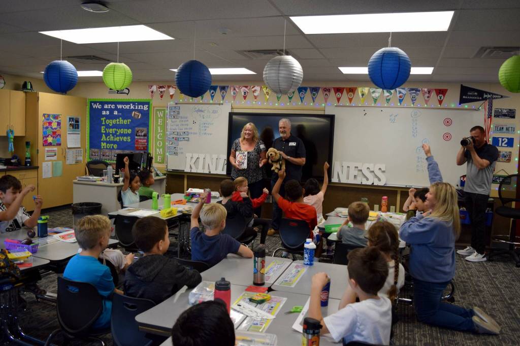 Carla Netus second grade class at North Bend Elementary listen to a presentation by Clark and Karrie Roberts. Photo by Conor Wilson/Valley Record