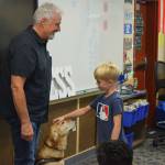Clark Roberts greets a student at North Bend Elementary on Sept. 16. Photo by Conor Wilson/Valley Record