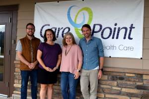 CarePoint Clinic and Snoqualmie Valley Alliance Church staff pose for a photo outside their clinic. From left: SVA Lead Pastor Baly Botten, Opperations Manager Misty Messer, Executive Director Tami Jones, Medical Director Todd Wright. Photo Conor Wilson/Valley Record.