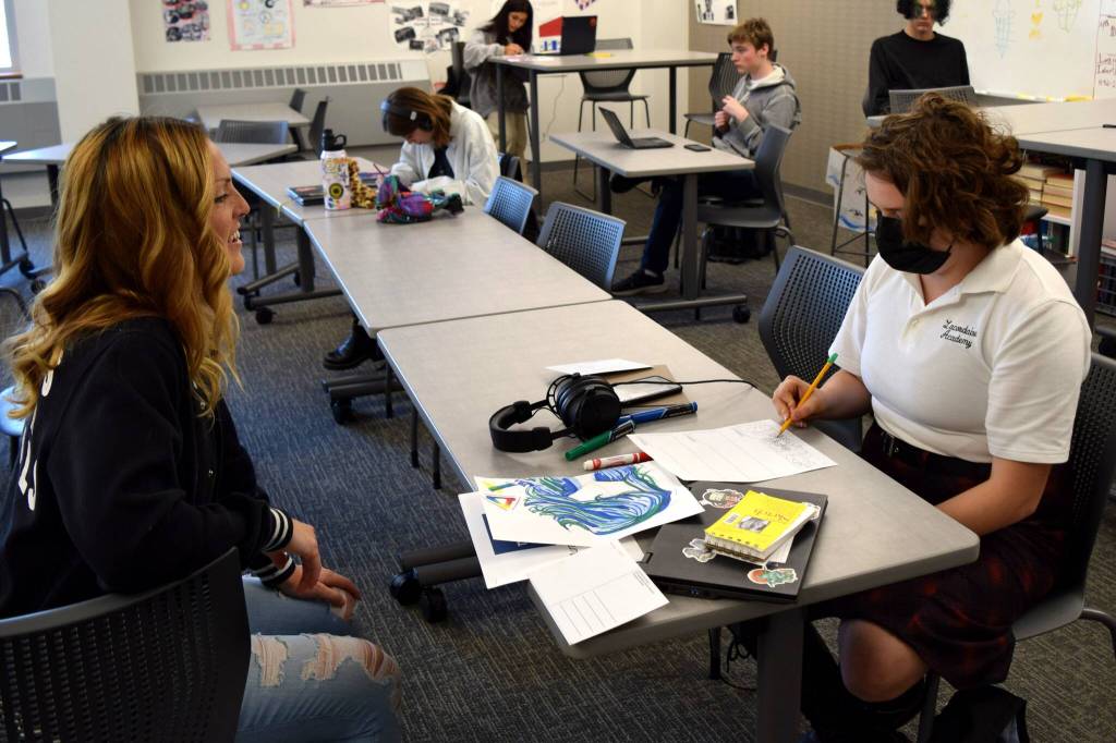 Conor Wilson / Valley Record.
Sarah Hughes speaks with a student at Two Rivers High School.