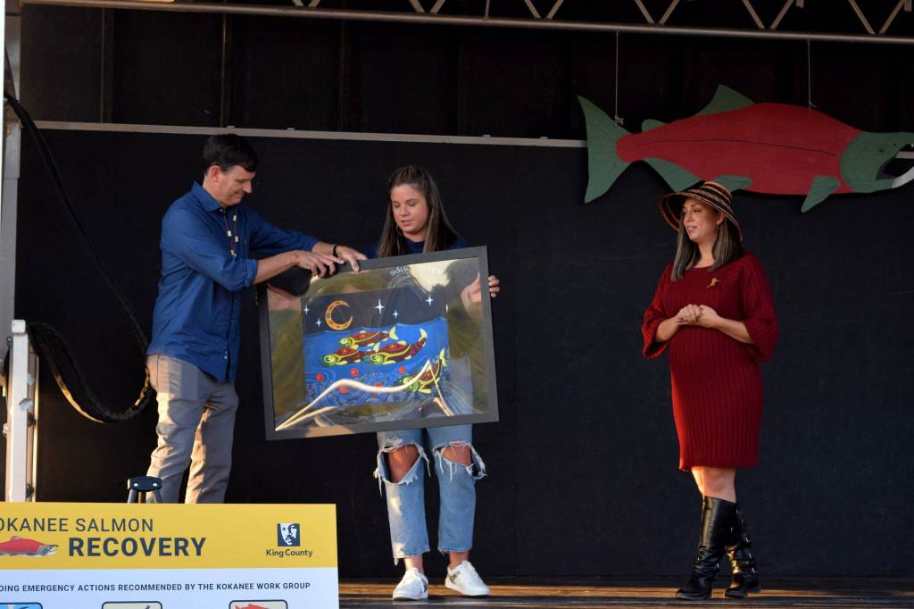 Perry Falcone (left) receives a gift from the Snoqualmie Tribe. Photo by Conor Wilson/Valley Record