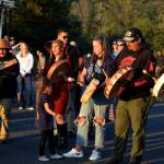 Conor Wilson / Valley Record 
Snoqualmie Tribal members play a song as the boat departs to release the kokanee at Lake Sammamish State Park.